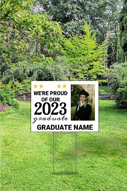 image of graduate on a sign in a yard